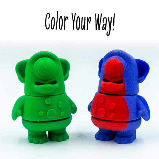 Blink Cyclops Alien two colorways of this customizable animal figure shown with 'color your way!'—perfect for mix-and-match creativity