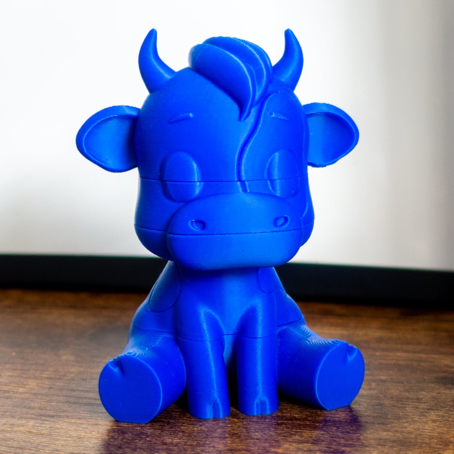 Mooch the cow toy featuring smooth slide-on connectors and playful puzzle layers