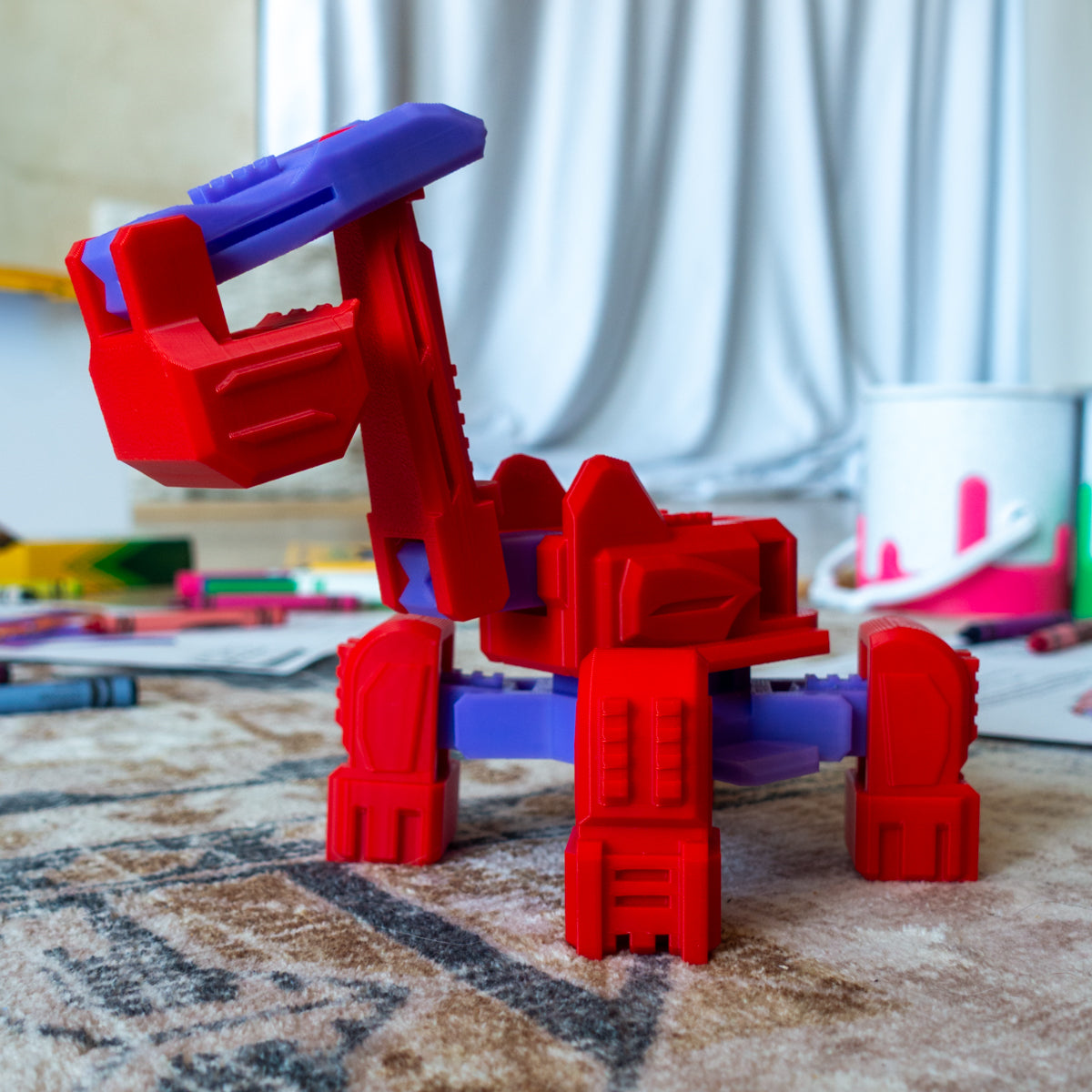 Diggs the Excavator toy in action on carpet, featuring a working scoop arm and modular articulating frame