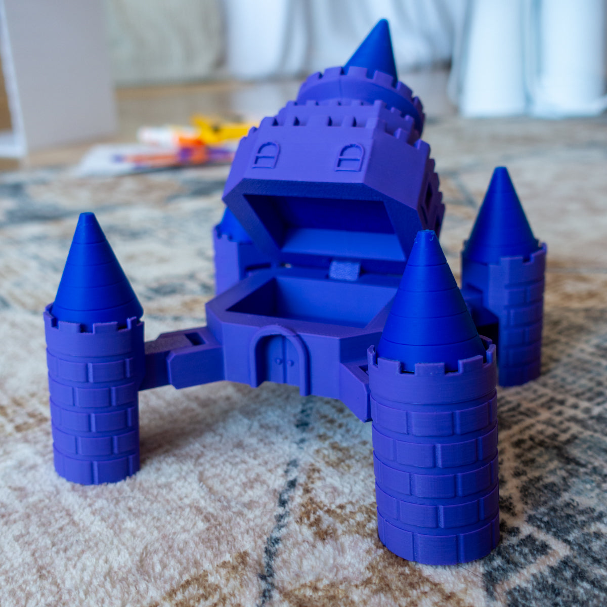 Fourtress the Mecha Castle toy posed on carpet in battle stance, top opened like a clam shell and tower joints fully poseable