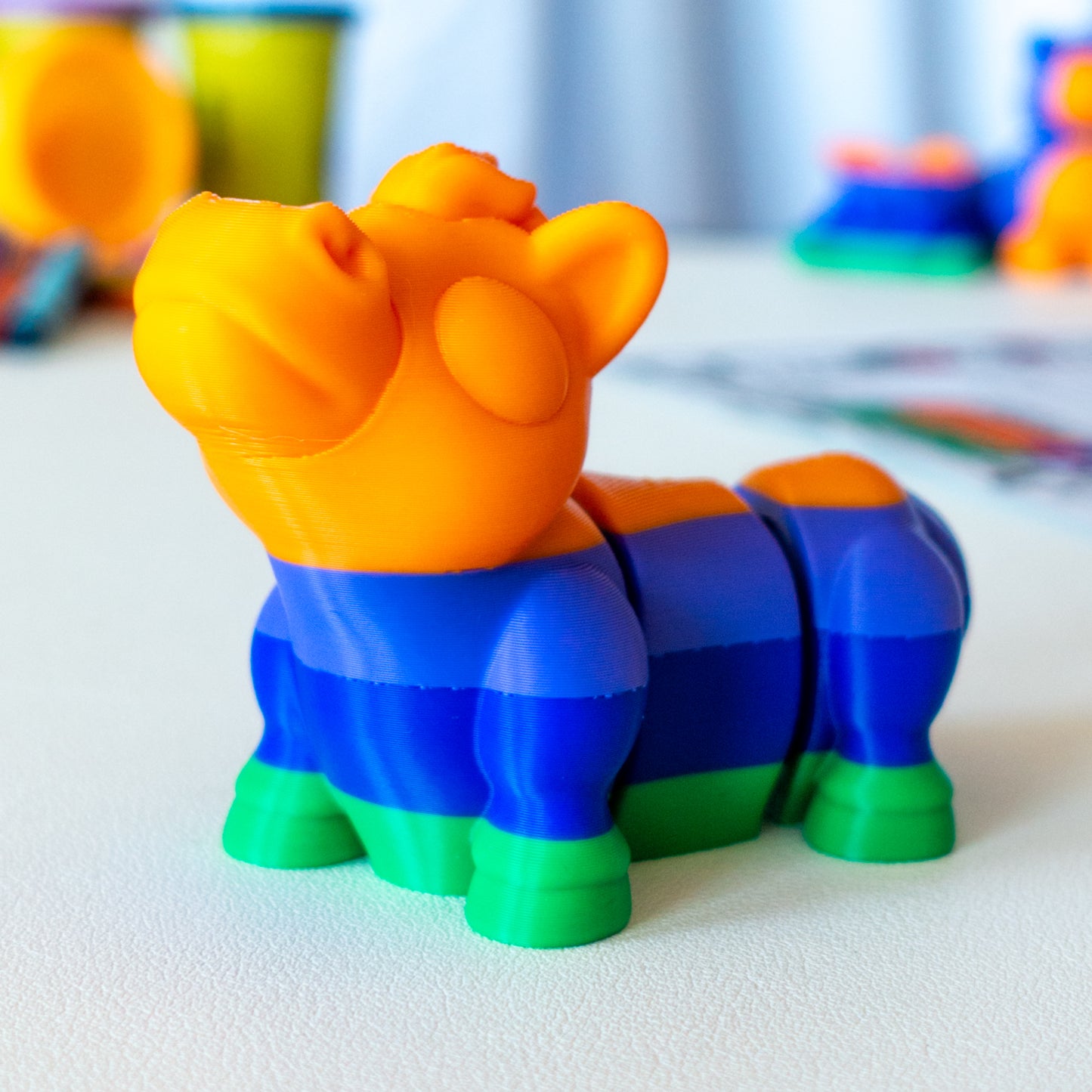 Gidd Horse custom articulated animal toy posed on a coffee table, designed for tactile play and fidget-friendly movement