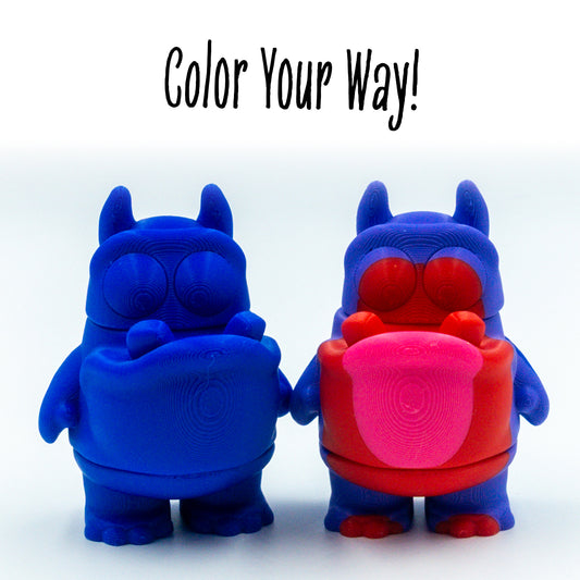 Gloop Toothy Alien two colorways of this customizable animal figure shown with 'color your way!'—perfect for mix-and-match creativity