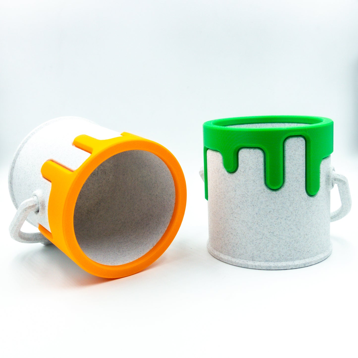 Two paint cans in alternative colorways.