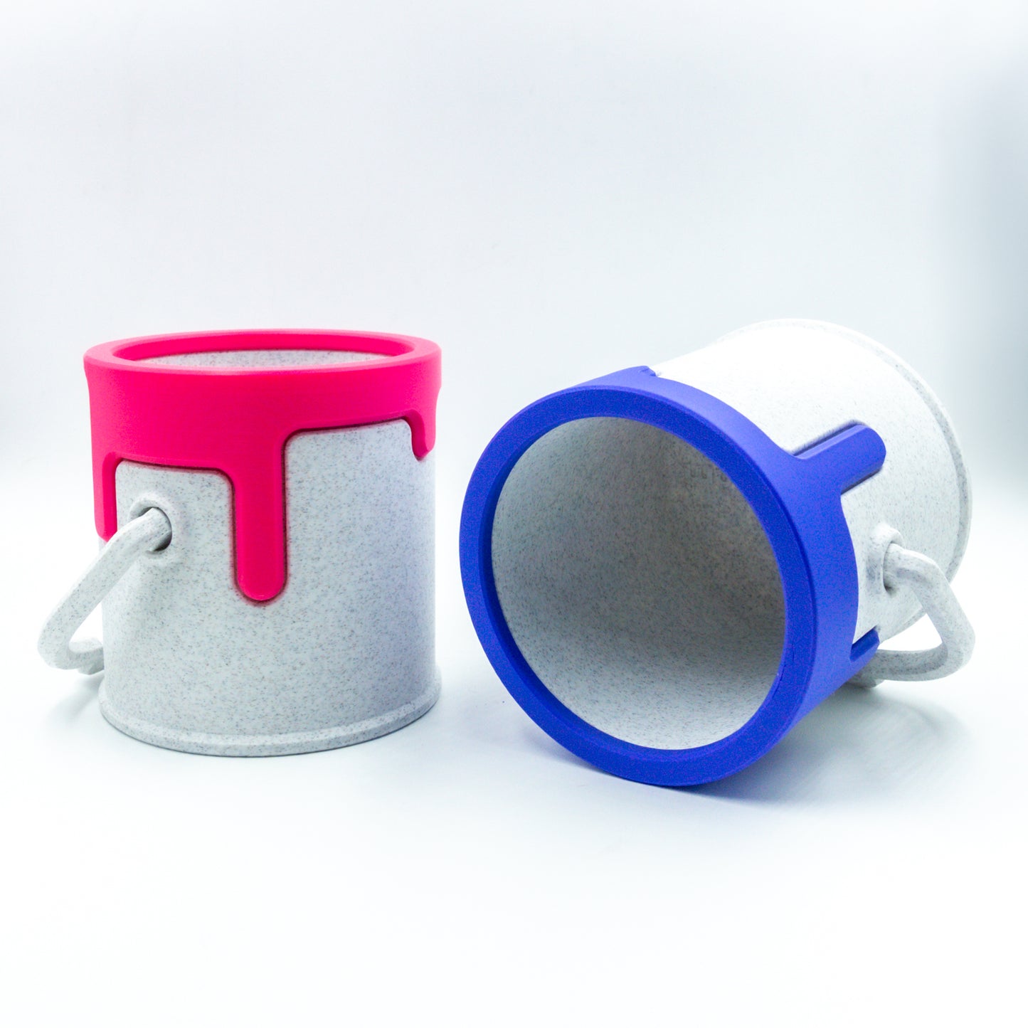 Two paint cans, one on its side.