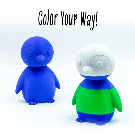 Close-up of Waddle the penguin in two customized versions featuring engraved detail and a grippable shape