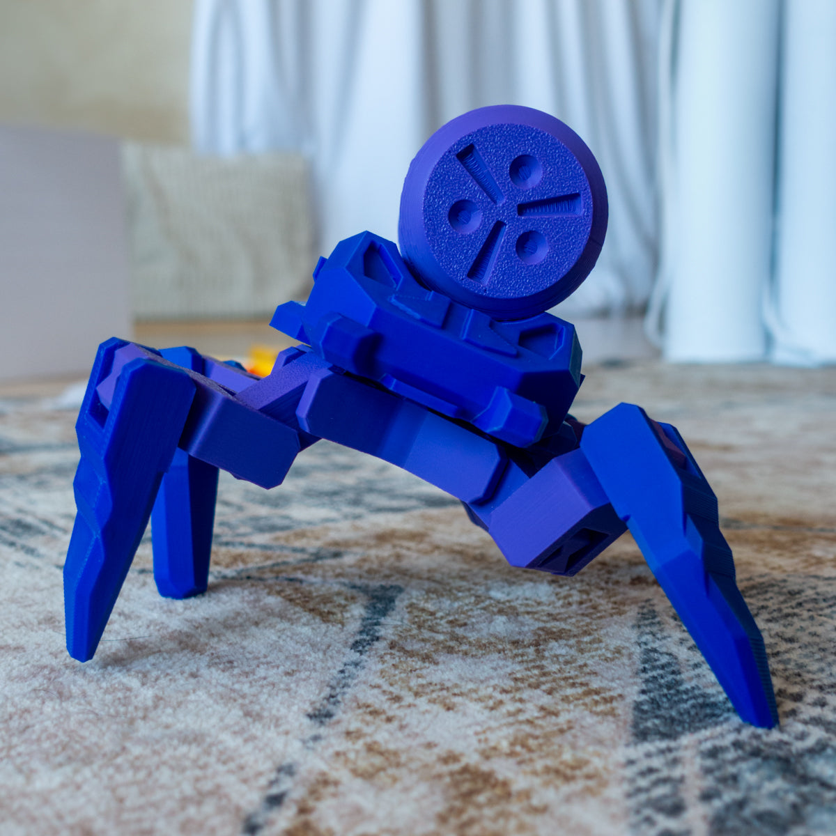 Refewl the Paint Bot posed on carpet with articulating paint tank arm design