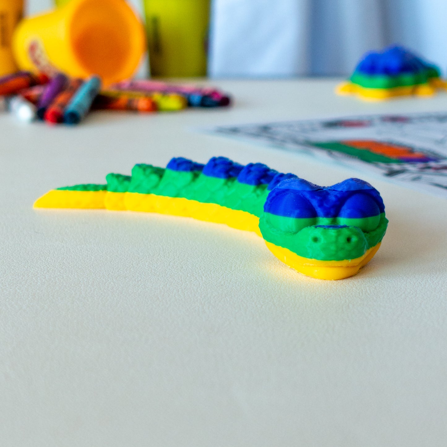 Main view of the articulated animal toy showing articulated design and appealing tactile features