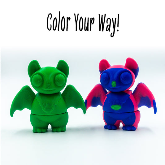 Swoosh Bat two colorways of this customizable animal figure shown with 'color your way!'—perfect for mix-and-match creativity