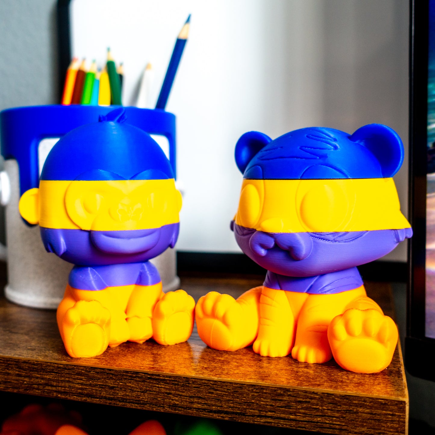Roar the tiger and Rumble the gorilla shown fully stacked, highlighting the satisfying alignment of their four stackable slide-on slices