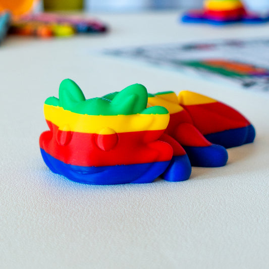 Gloam viewed from a flat-lay angle, highlighting its articulated shape and smooth finish