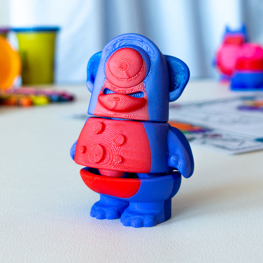 Blink Cyclops Alien custom articulated animal toy posed on a coffee table, designed for tactile play and fidget-friendly movement