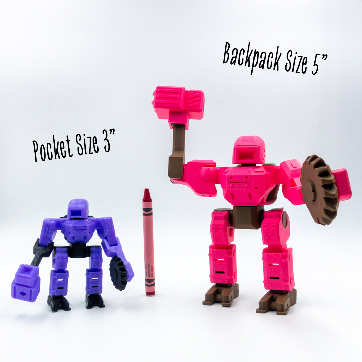 Chief Chroma in 3-inch and 5-inch customizable formats next to a crayon for scale—modular pieces compatible across sizes for build-your-own fun