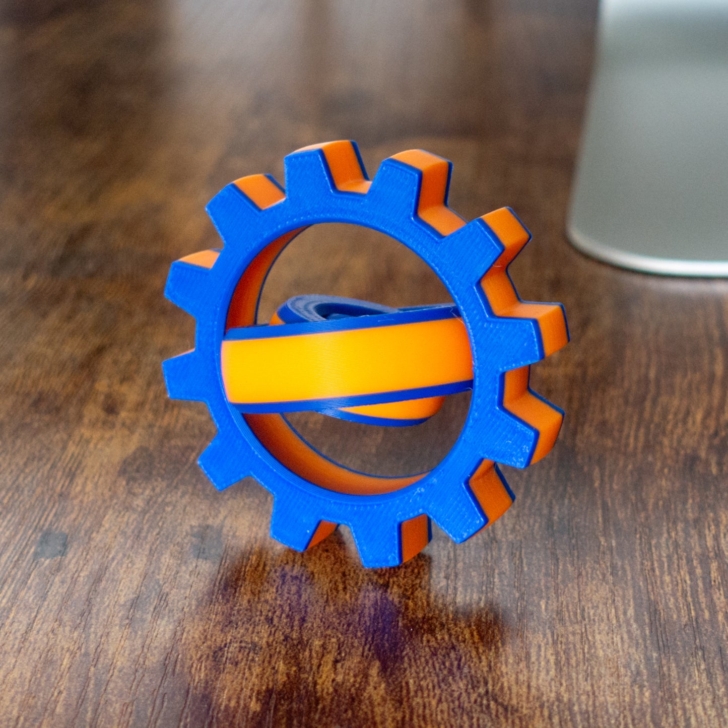Colorful Cog Fidget Spin variation with articulated design and tactile details in action.