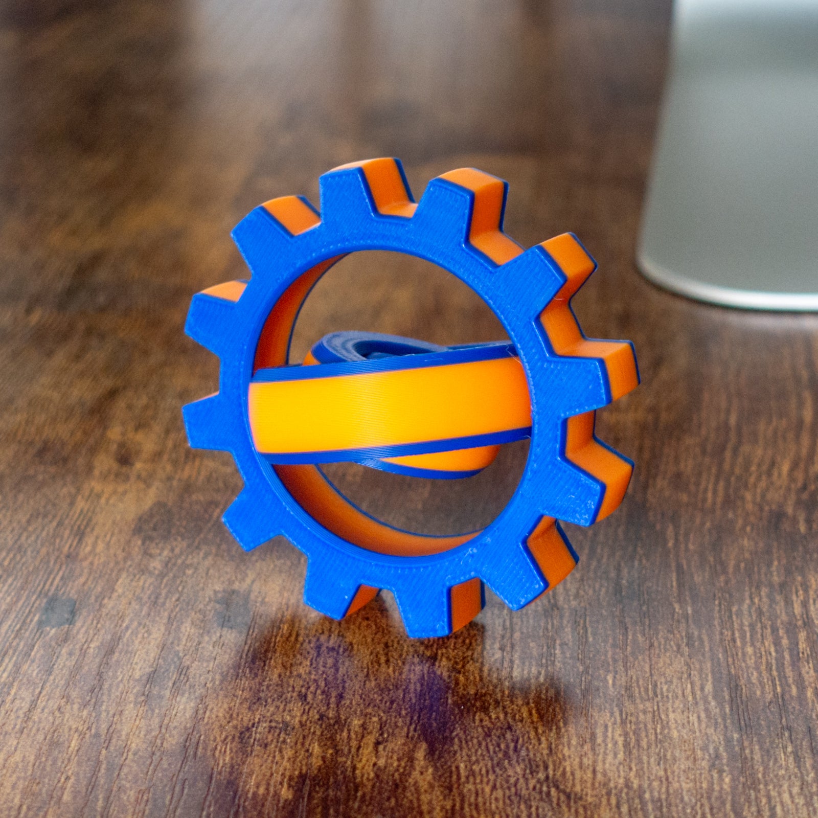Colorful Cog Fidget Spin variation with articulated design and tactile details in action.