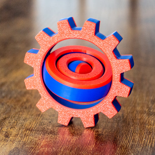 Cog Spin fidget toy in lifestyle setting with articulated design and tactile details.