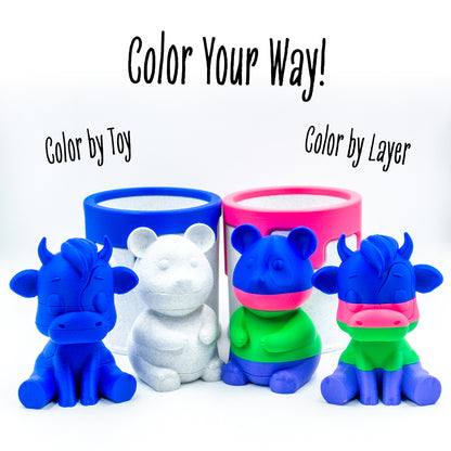 Two pairs of Mooch the cow and Munch the panda with their paint cans