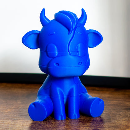 Mooch the cow toy featuring smooth slide-on connectors and playful puzzle layers