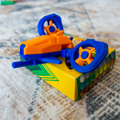 DosFly the Dual Drone mid-action on a cozy carpet, demonstrating modular articulation designed for creative posing