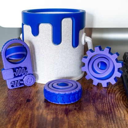 Engineer Pack featuring 3 fidget toys and a paint can in lifestyle setting with articulated design and tactile details.