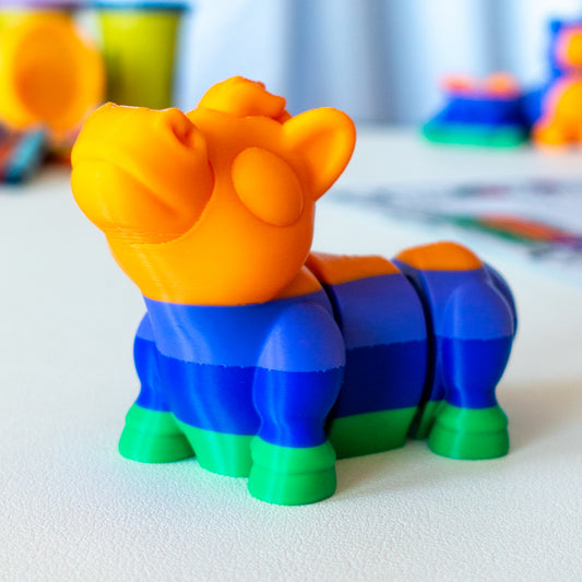 Gidd Horse custom articulated animal toy posed on a coffee table, designed for tactile play and fidget-friendly movement