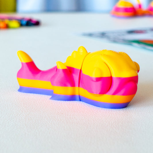 Flicker viewed from a flat-lay angle, highlighting its articulated shape and smooth finish