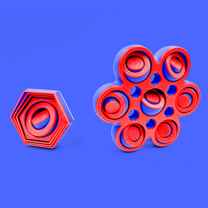 Red and blue fidget spinner toys on a blue background