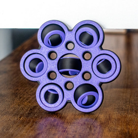Hexaspin fidget in action with articulated design and tactile details.