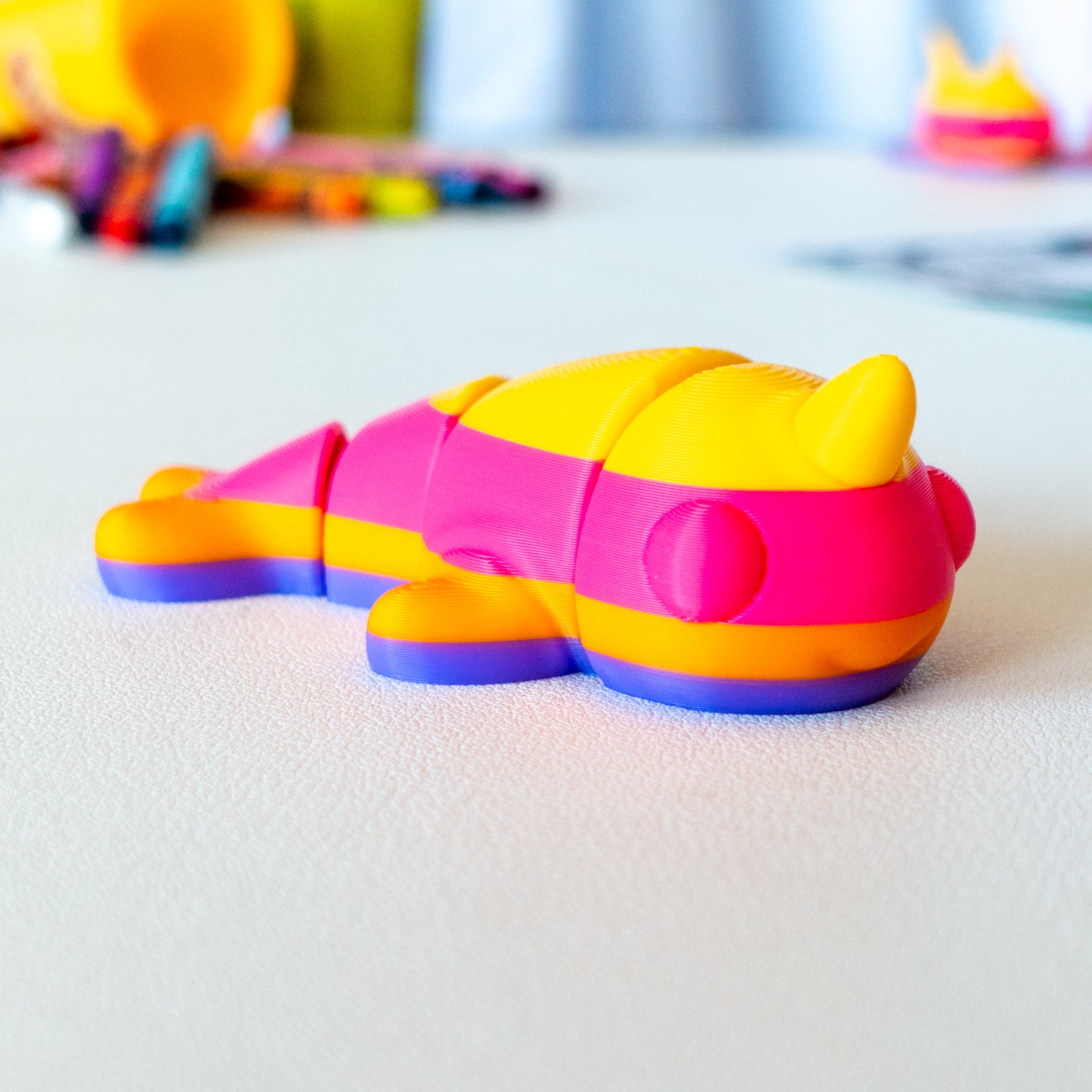 Spiral viewed from a flat-lay angle, highlighting its articulated shape and smooth finish