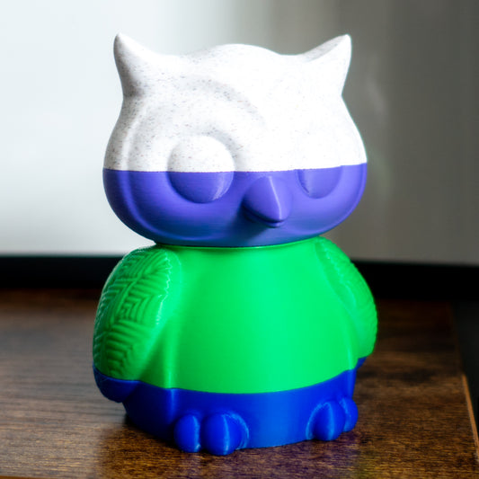 Hoot the owl shown fully stacked in four satisfying slices, ideal for tactile desk play