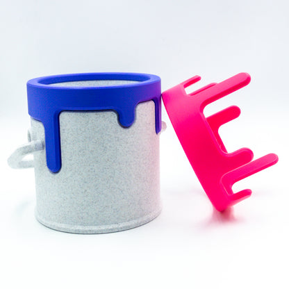 A paint can and its alternate swappable color drip.