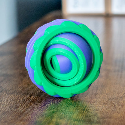 Colorful version of Portalspinner in lifestyle use with articulated design and tactile details.