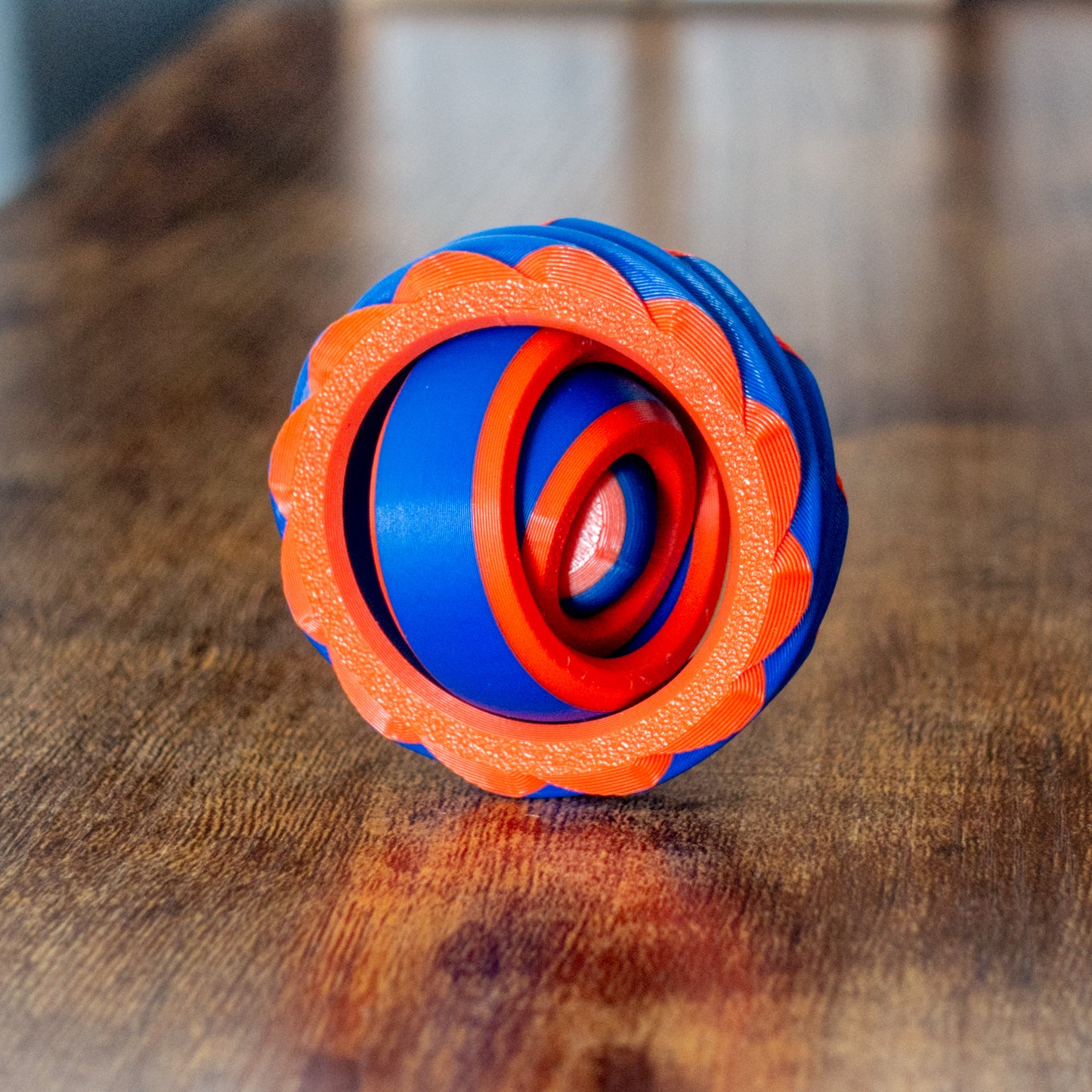 Alternate colorway of Portalspinner fidget shown in everyday context with articulated design and tactile details.