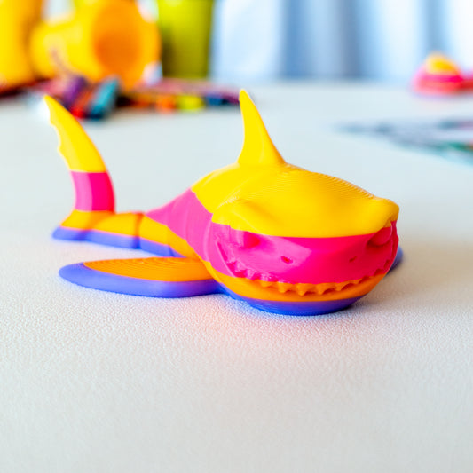Chomps viewed from a flat-lay angle, highlighting its articulated shape and smooth finish