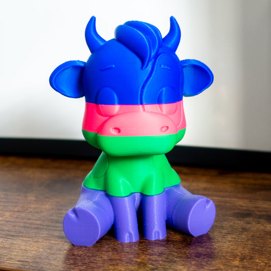 Mooch the cow shown fully stacked in four satisfying slices, ideal for tactile desk play