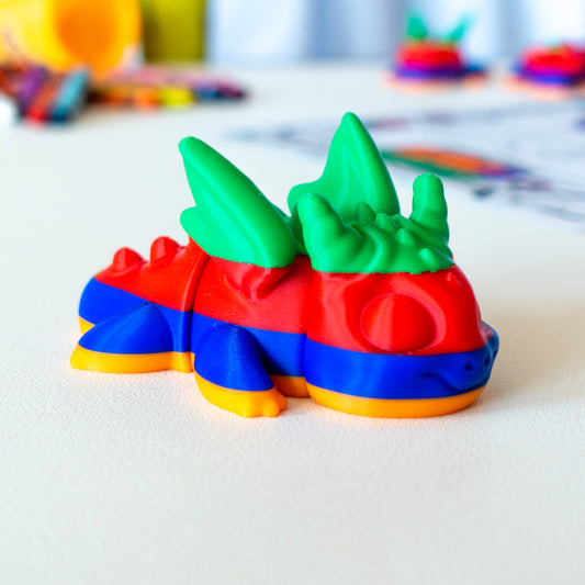 Whisp viewed from a flat-lay angle, highlighting its articulated shape and smooth finish