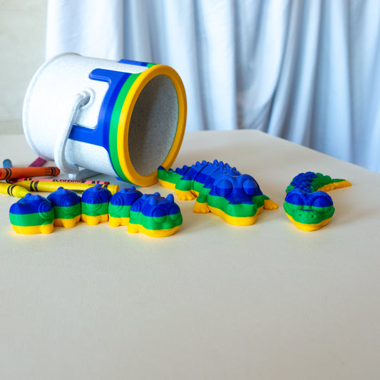 Main view of the articulated animal toy set showing overall design and color details featuring a caterpillar, crocodile and snake. 